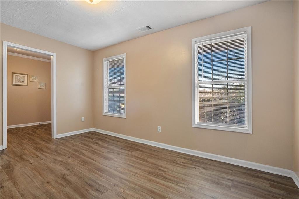 2000 Sage Court Loganville, GA 30052 - Photo 7 of 35 an empty room with wooden floor and windows