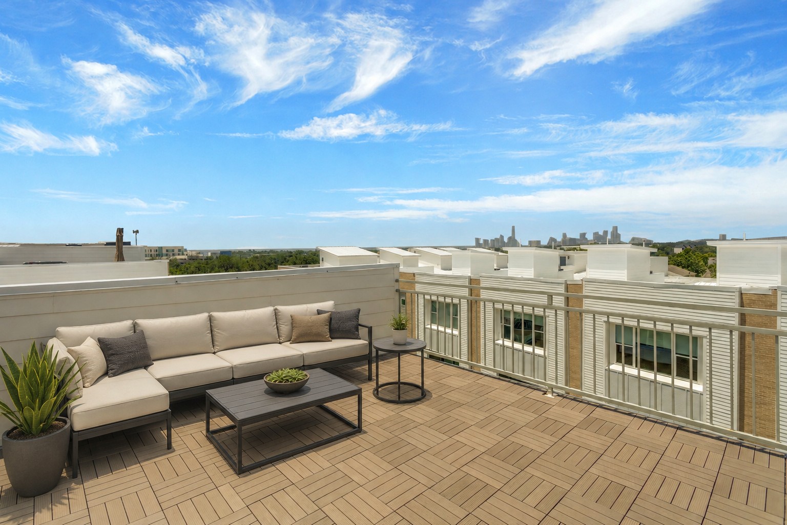City skyline views await from this expansive outdoor rooftop terrace, perfect for entertaining.