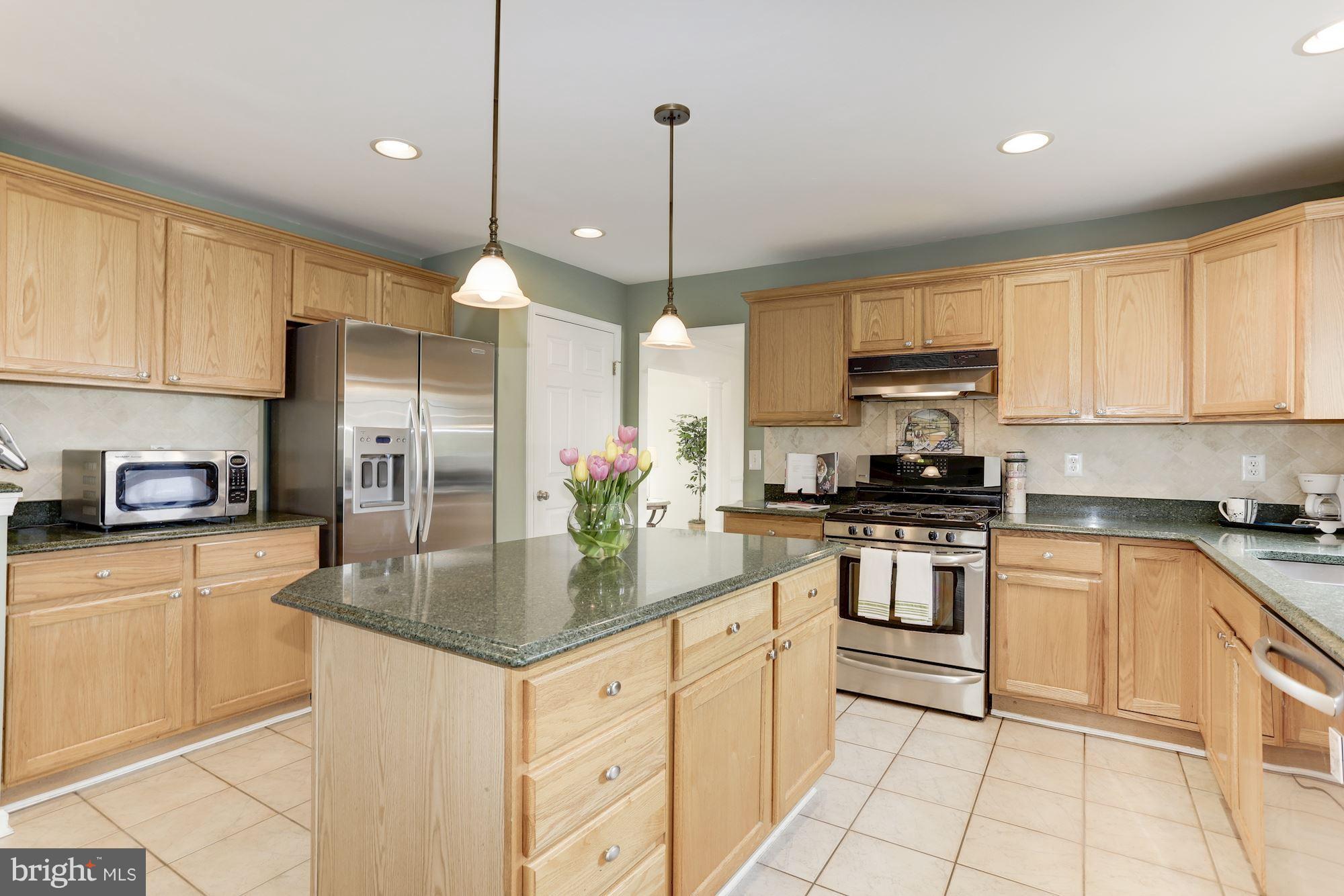 5905 Sandy Ridge Elkridge, MD 21075 - Photo 6 of 30 Kitchen has stainless steel appliances.