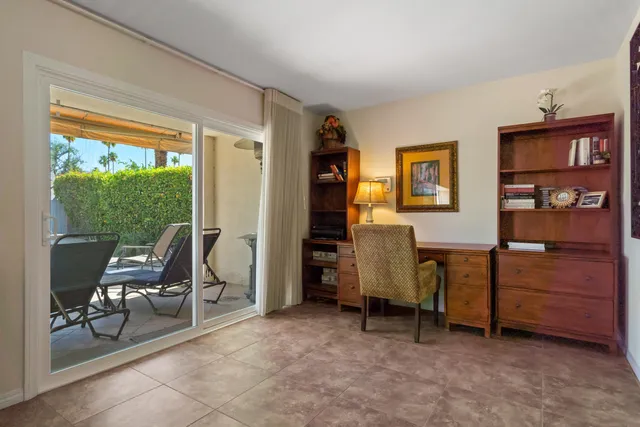 a view of room with furniture and a window