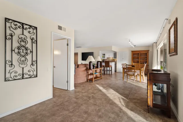 a view of a livingroom with furniture and a flat screen tv