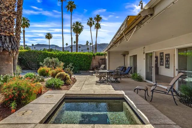 a view of a swimming pool with a patio