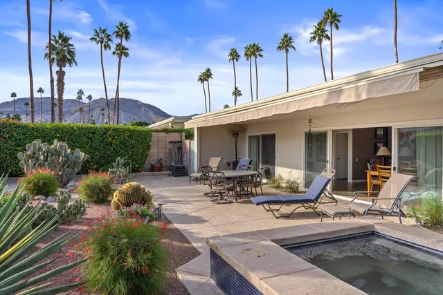 a view of a house with sitting area and furniture