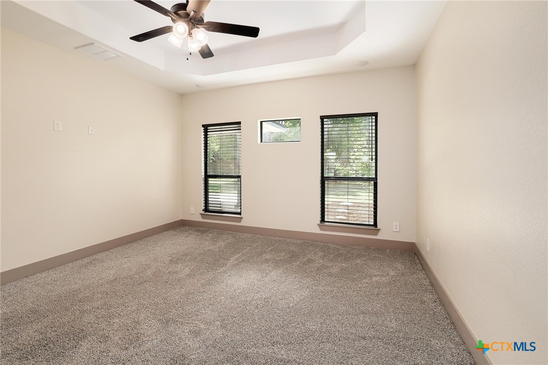 2892 Beulah Boulevard Belton, TX 76513 - Photo 15 of 39 an empty room with windows and fan