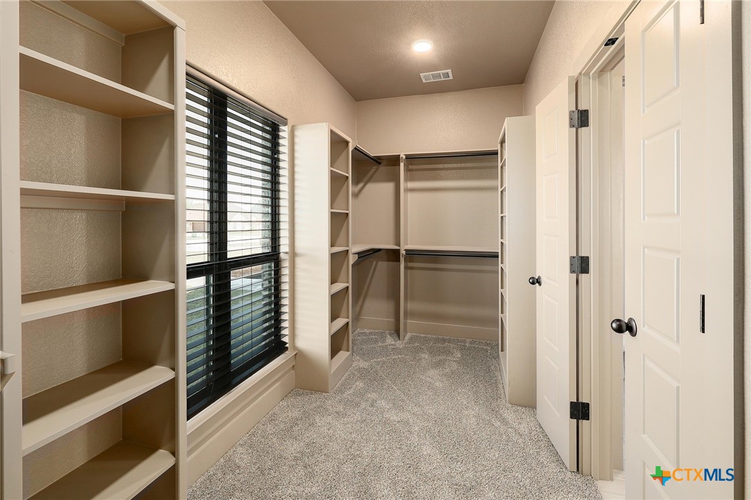2892 Beulah Boulevard Belton, TX 76513 - Photo 19 of 39 a view of closet area with empty shelves