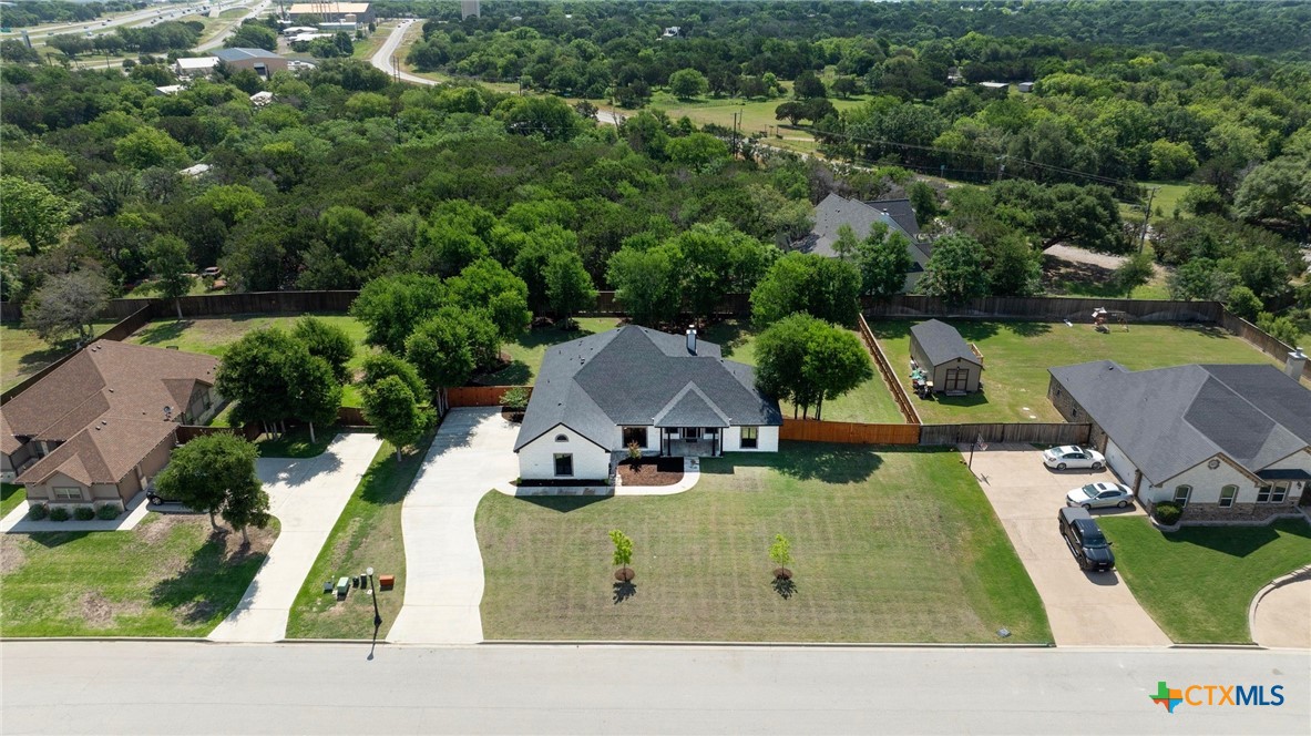 2892 Beulah Boulevard Belton, TX 76513 - Photo 2 of 39 an aerial view of a house with swimming pool and a yard