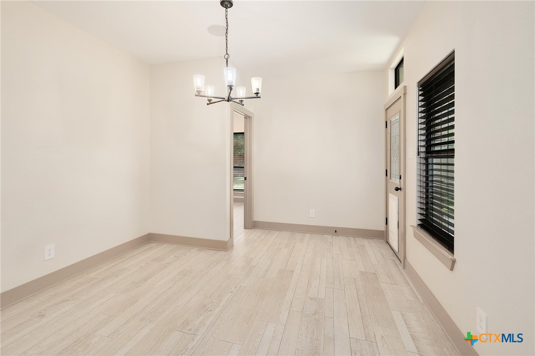 2892 Beulah Boulevard Belton, TX 76513 - Photo 10 of 39 a view of empty room with wooden floor