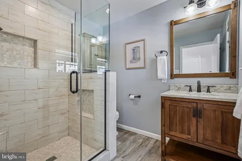 a living room with furniture a window and a fireplace