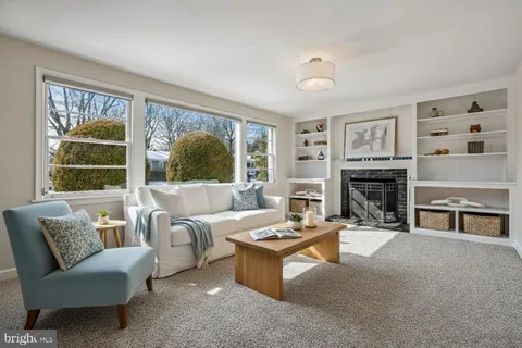 a backyard of a house with seating space and trees