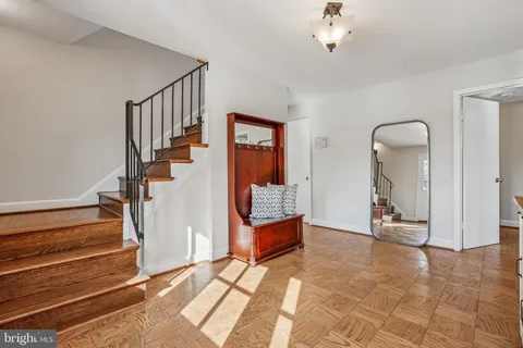 a living room with furniture a window and a fireplace