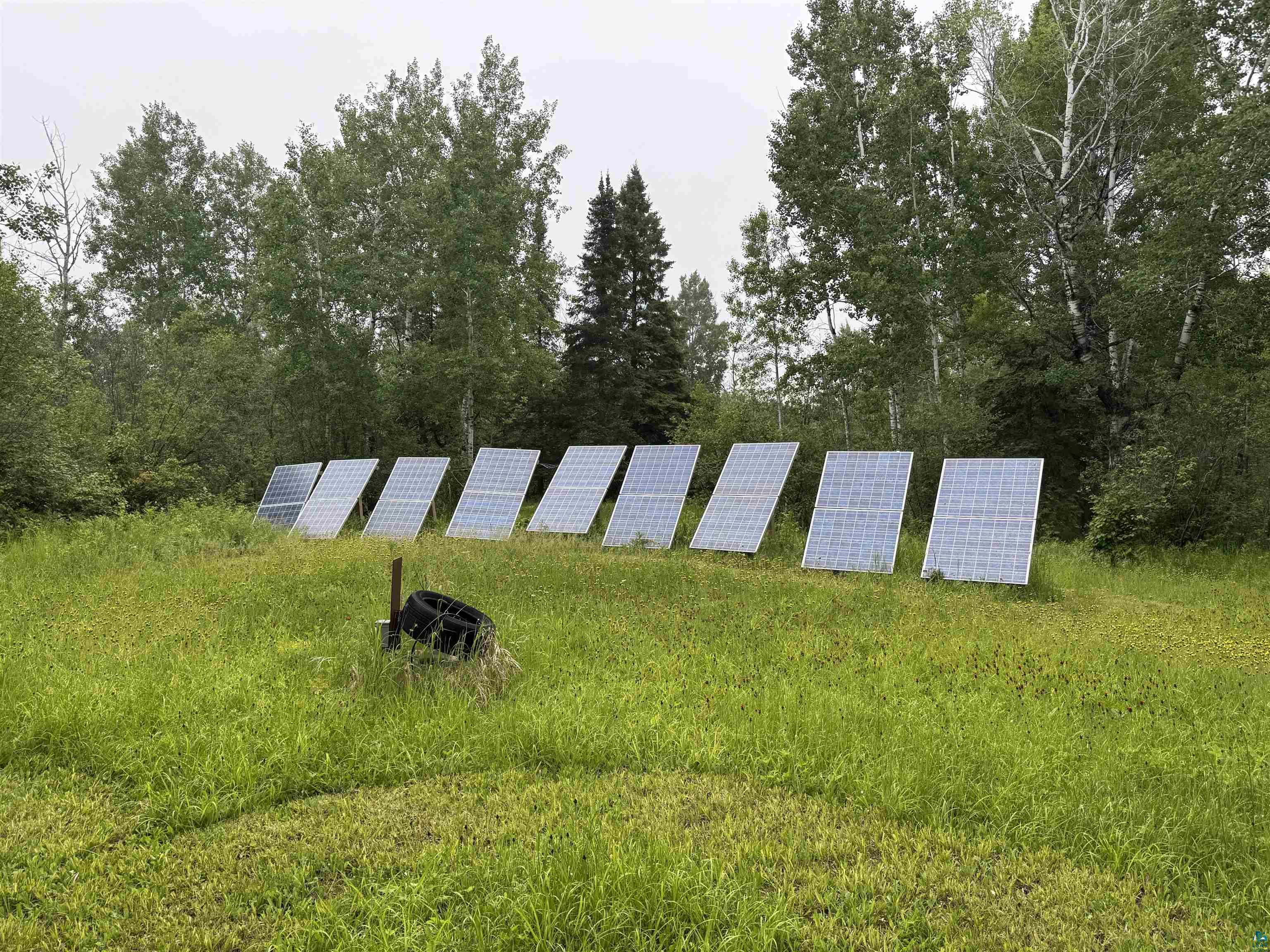 1745 Becks Road Maple, WI 54854 - Photo 45 of 46 Ground-mounted solar panel array featuring multiple panels