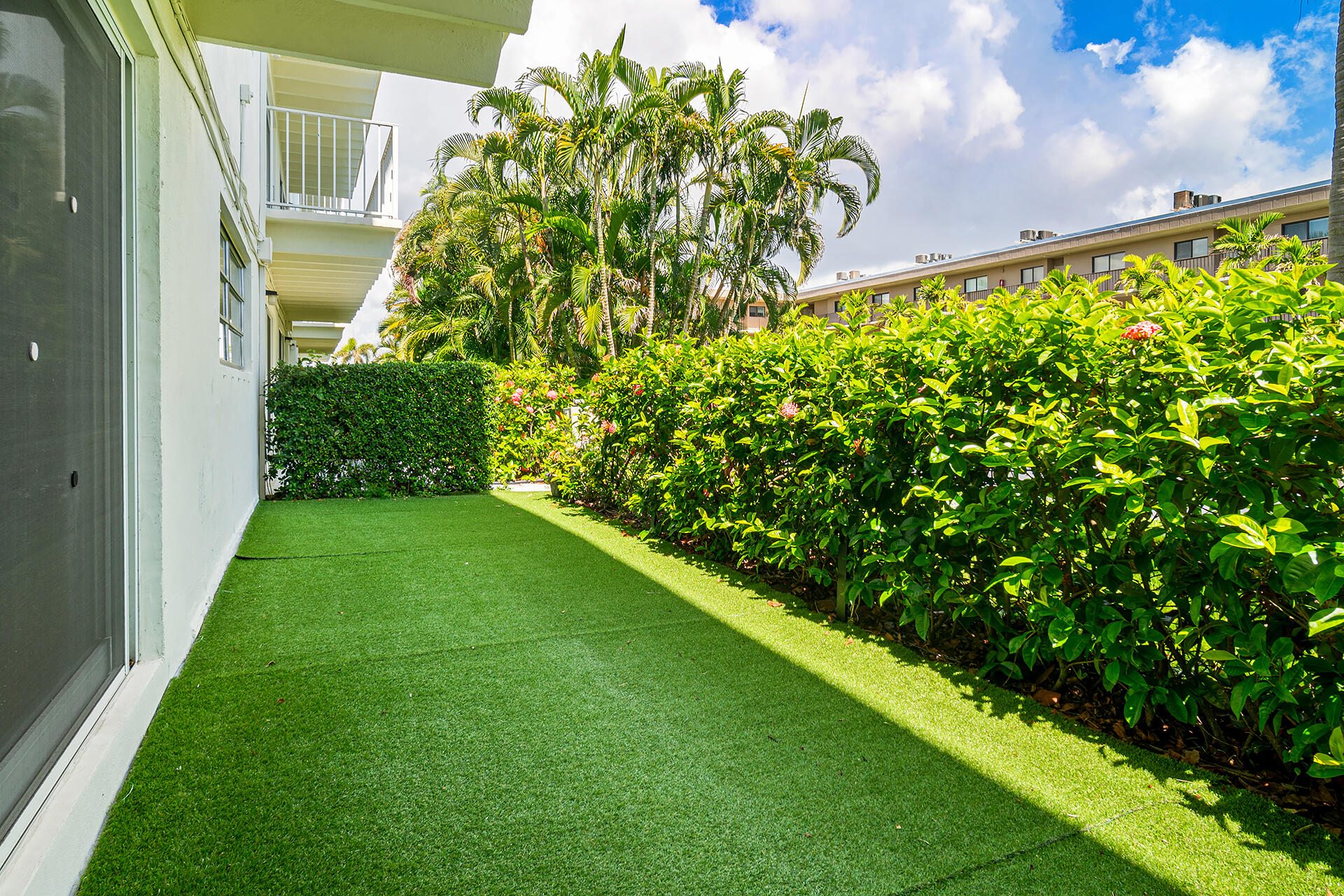 4001 South Ocean Boulevard, Unit 115 South Palm Beach, FL 33480 - Photo 15 of 25 a view of a yard with plants