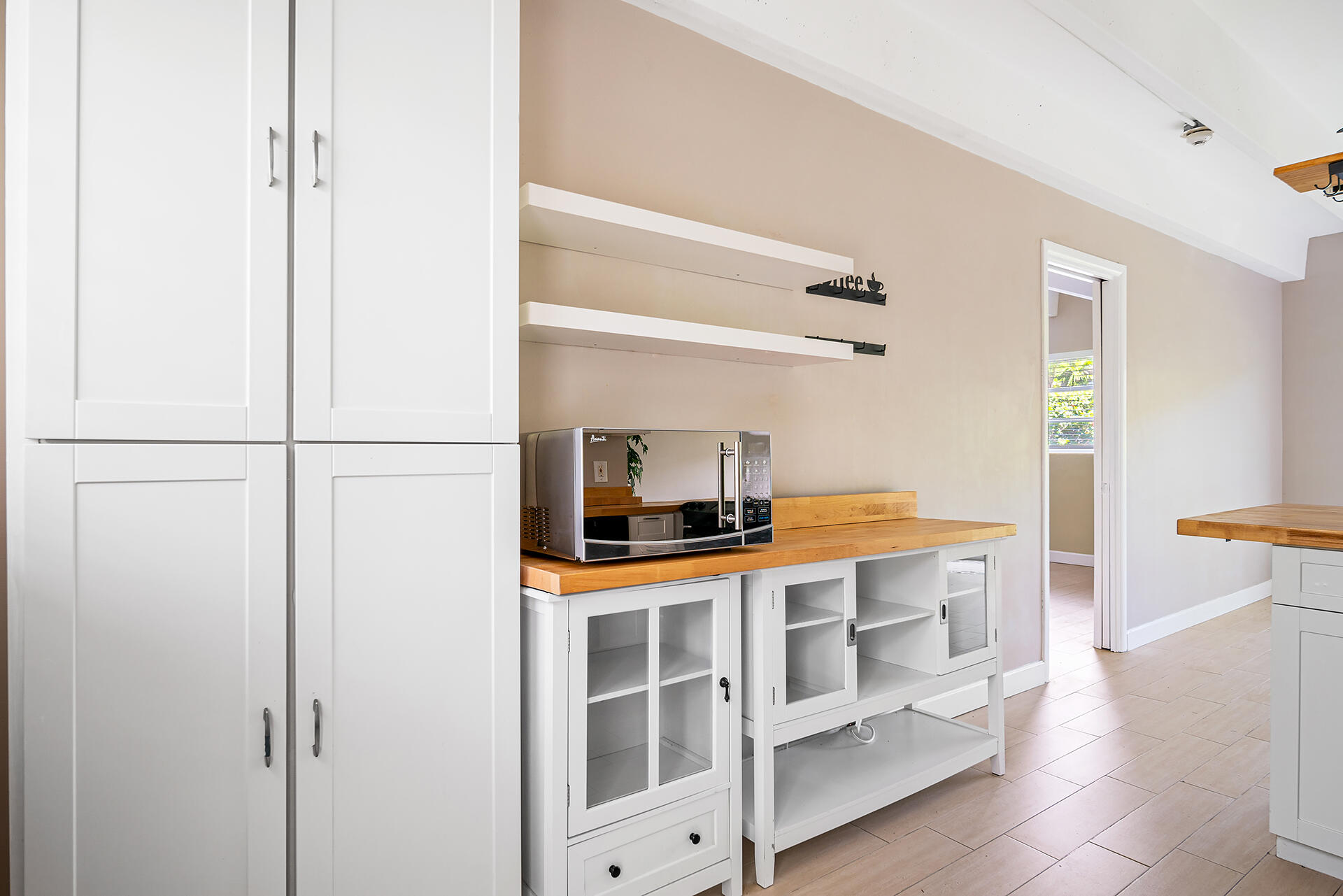 4001 South Ocean Boulevard, Unit 115 South Palm Beach, FL 33480 - Photo 10 of 25 a kitchen with a sink and cabinets