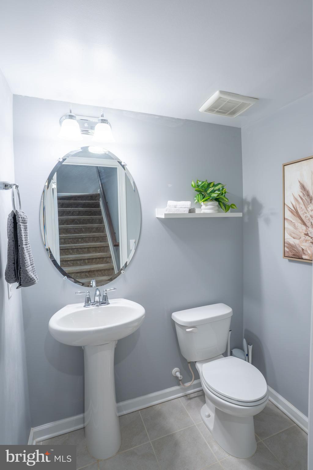 494 Rowan Street Warminster, PA 18974 - Photo 11 of 42 a bathroom with a toilet sink and mirror