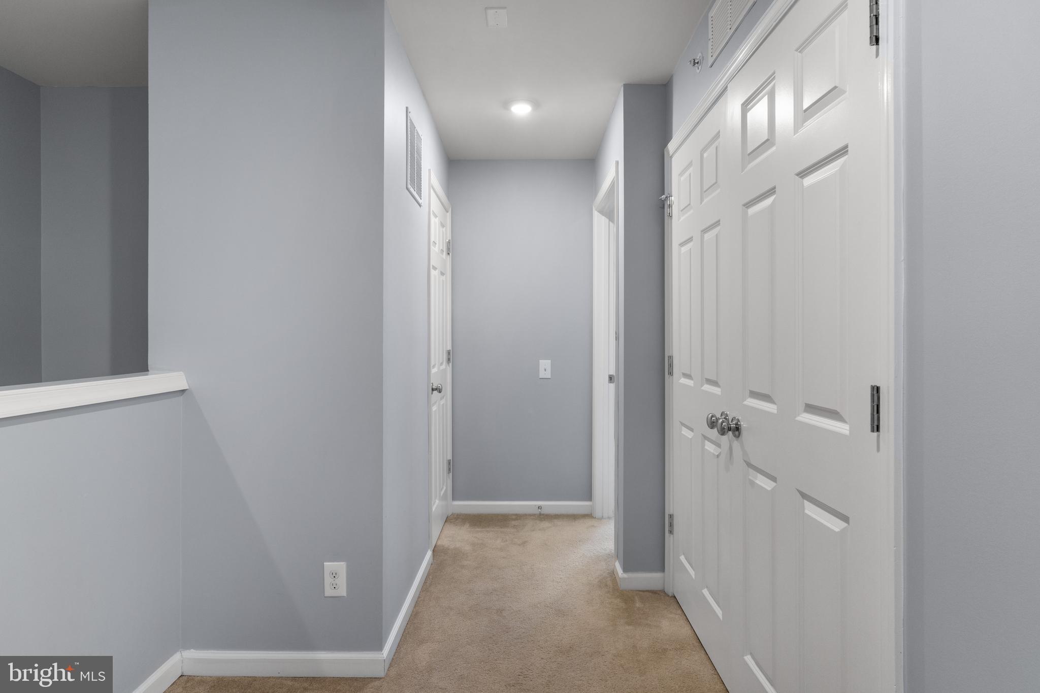 494 Rowan Street Warminster, PA 18974 - Photo 13 of 42 a view of a hallway with wooden floor