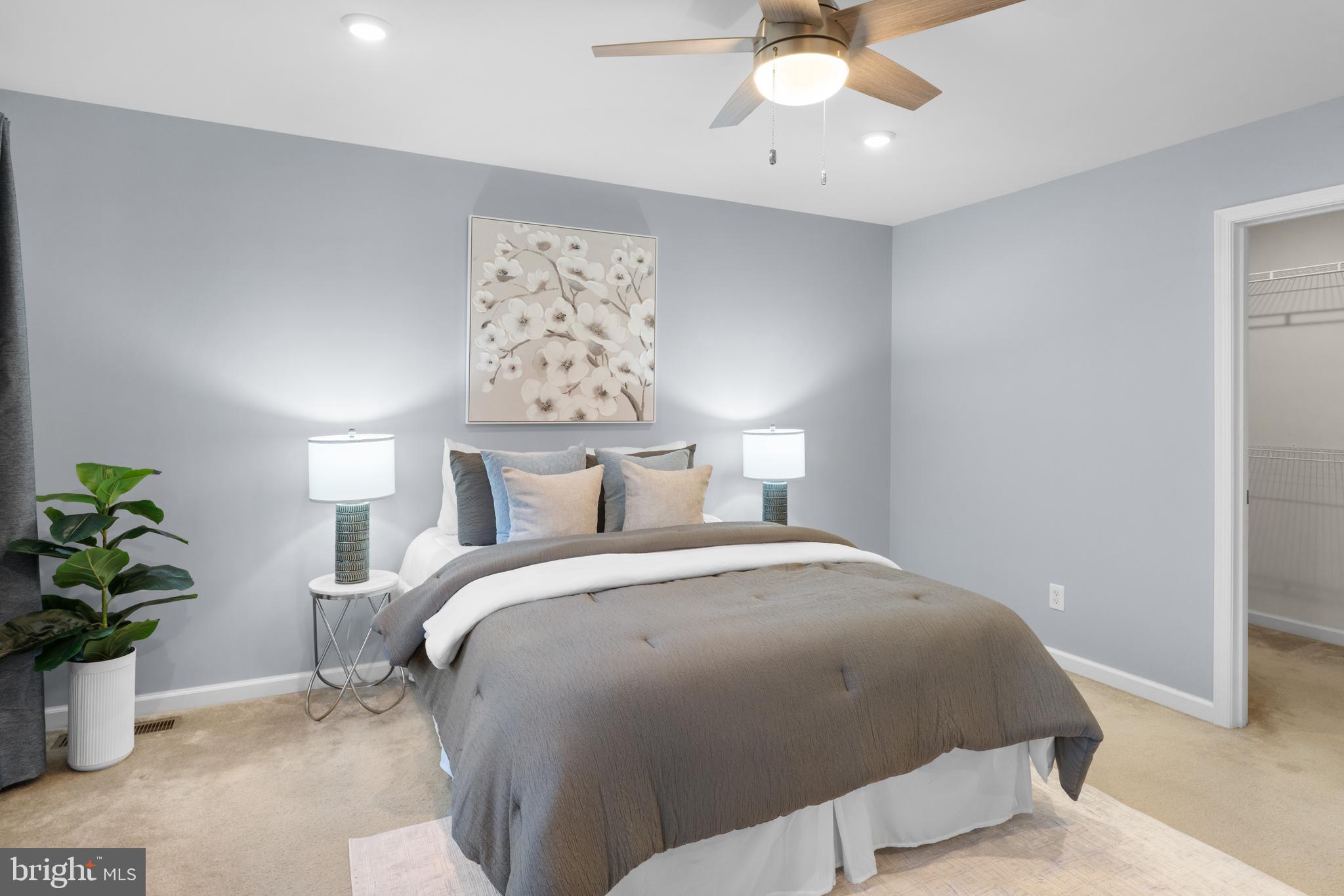 494 Rowan Street Warminster, PA 18974 - Photo 14 of 42 a bed room with a bed and a chandelier