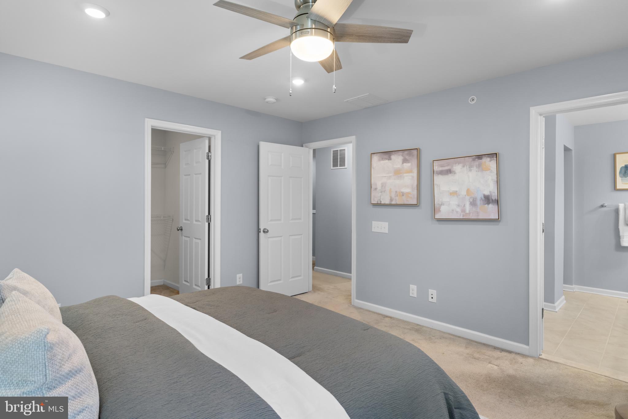 494 Rowan Street Warminster, PA 18974 - Photo 17 of 42 a bedroom with bed and a chandelier