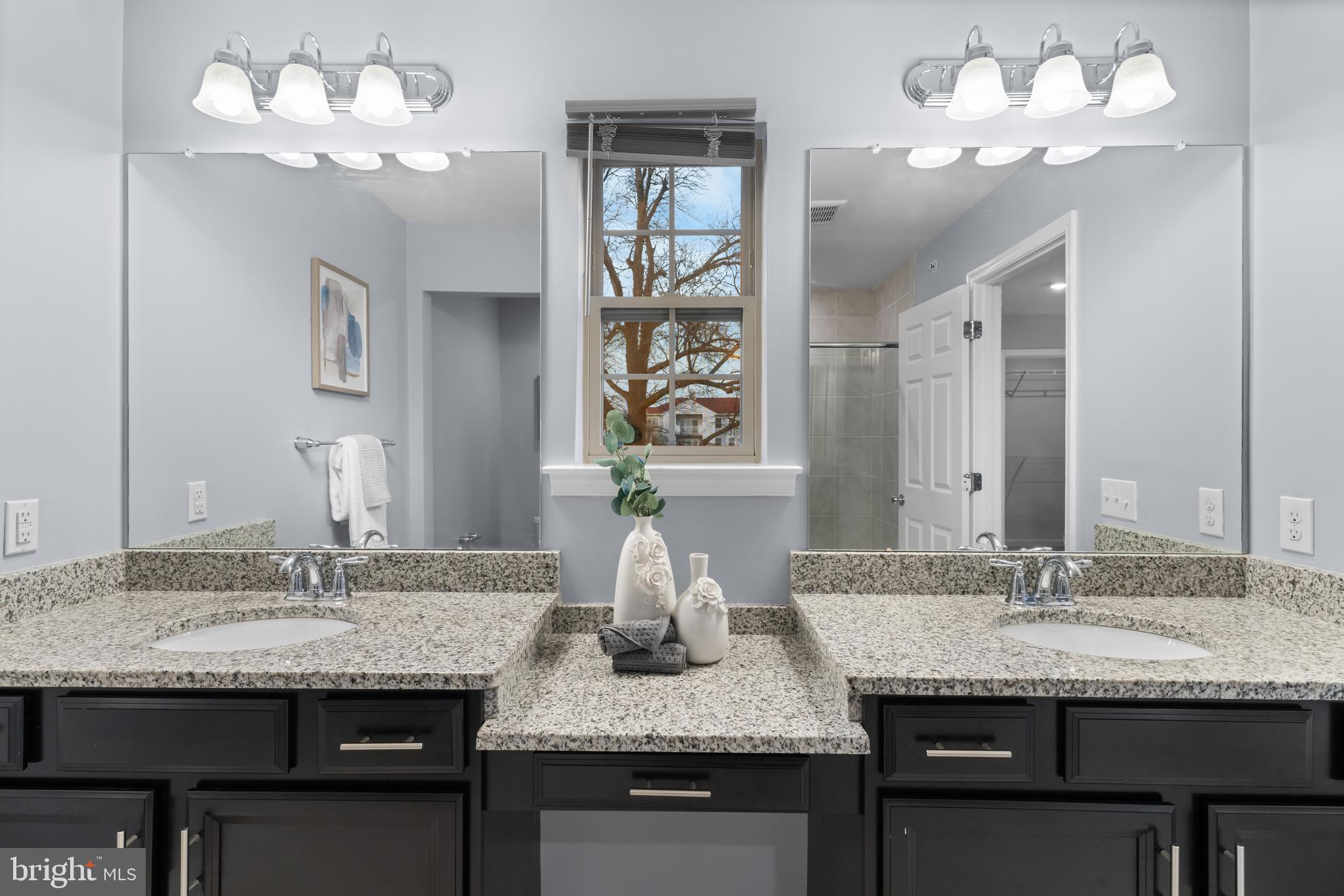 494 Rowan Street Warminster, PA 18974 - Photo 19 of 42 a bathroom with a granite countertop double vanity and a mirror