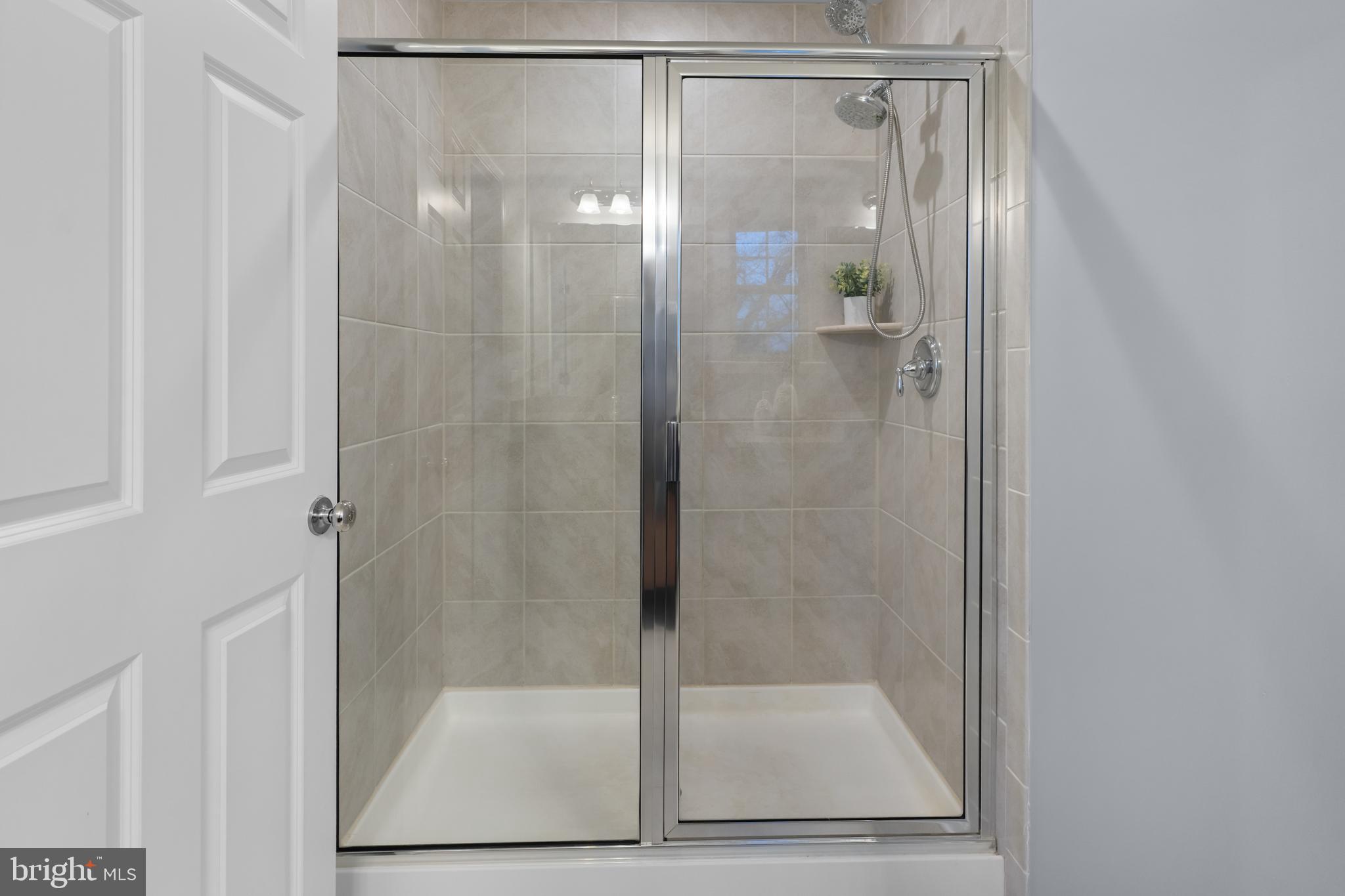494 Rowan Street Warminster, PA 18974 - Photo 25 of 42 a bathroom with a glass shower door