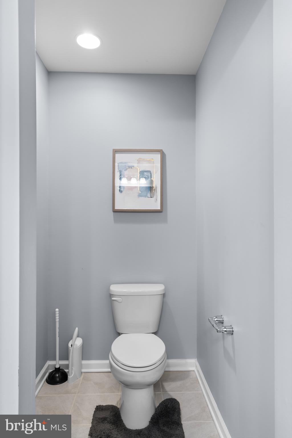 494 Rowan Street Warminster, PA 18974 - Photo 30 of 42 a white toilet sitting next to a bathroom sink