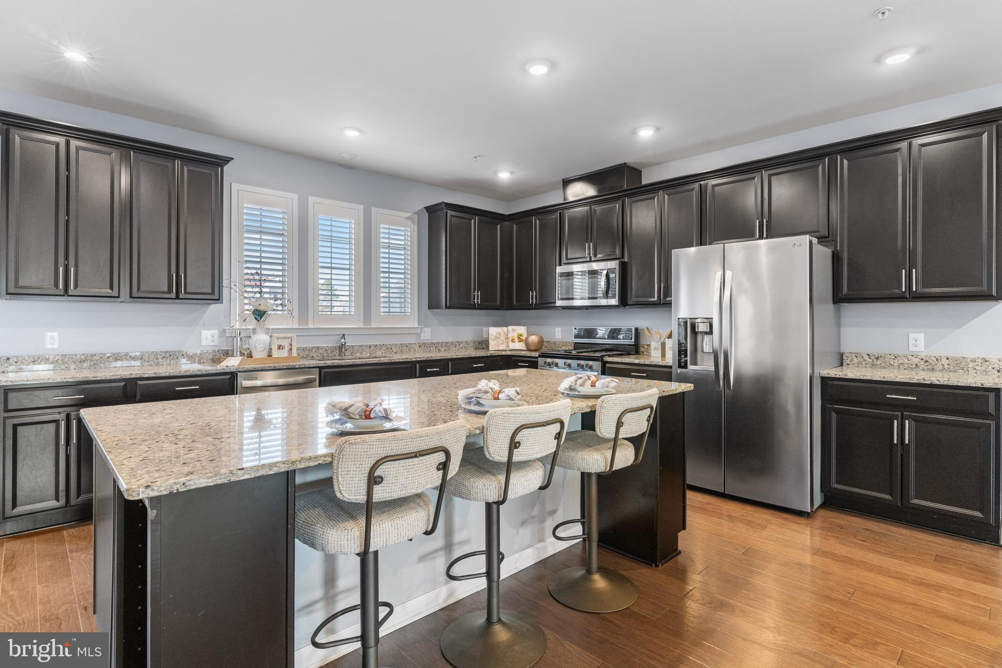 494 Rowan Street Warminster, PA 18974 - Photo 10 of 42 a kitchen with stainless steel appliances granite countertop a refrigerator a stove top oven a sink and dishwasher
