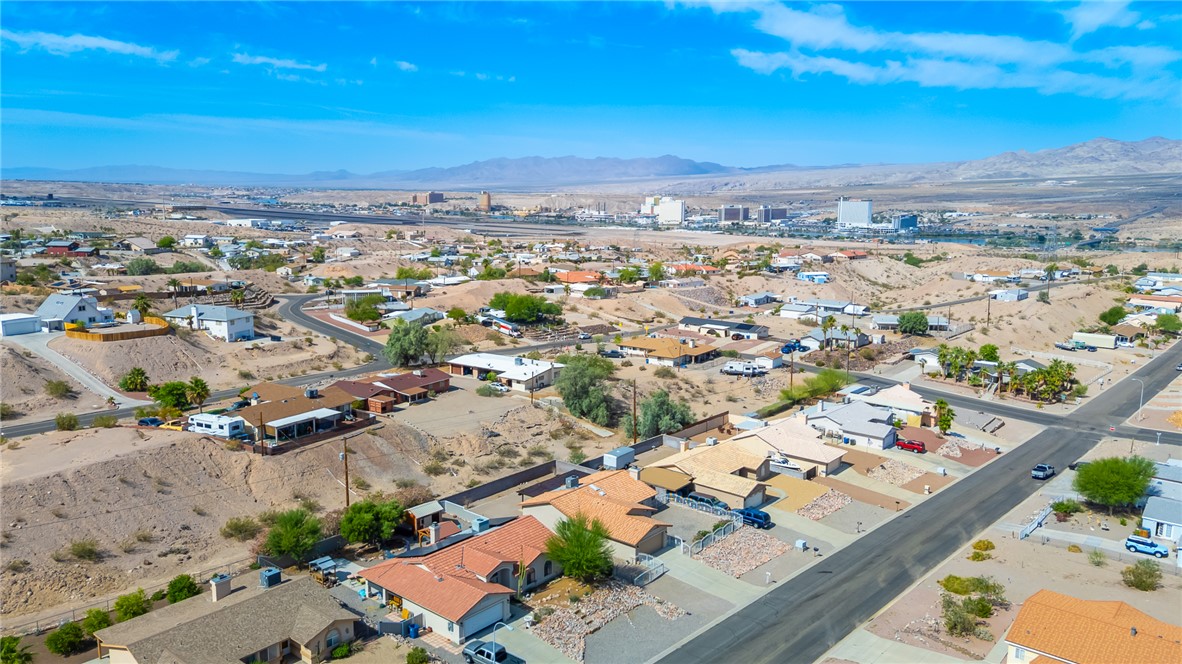 2524 South Ridge Avenue Bullhead City, AZ 86429 - Photo 55 of 64 Aerial view of residential area featuring a mountain backdrop