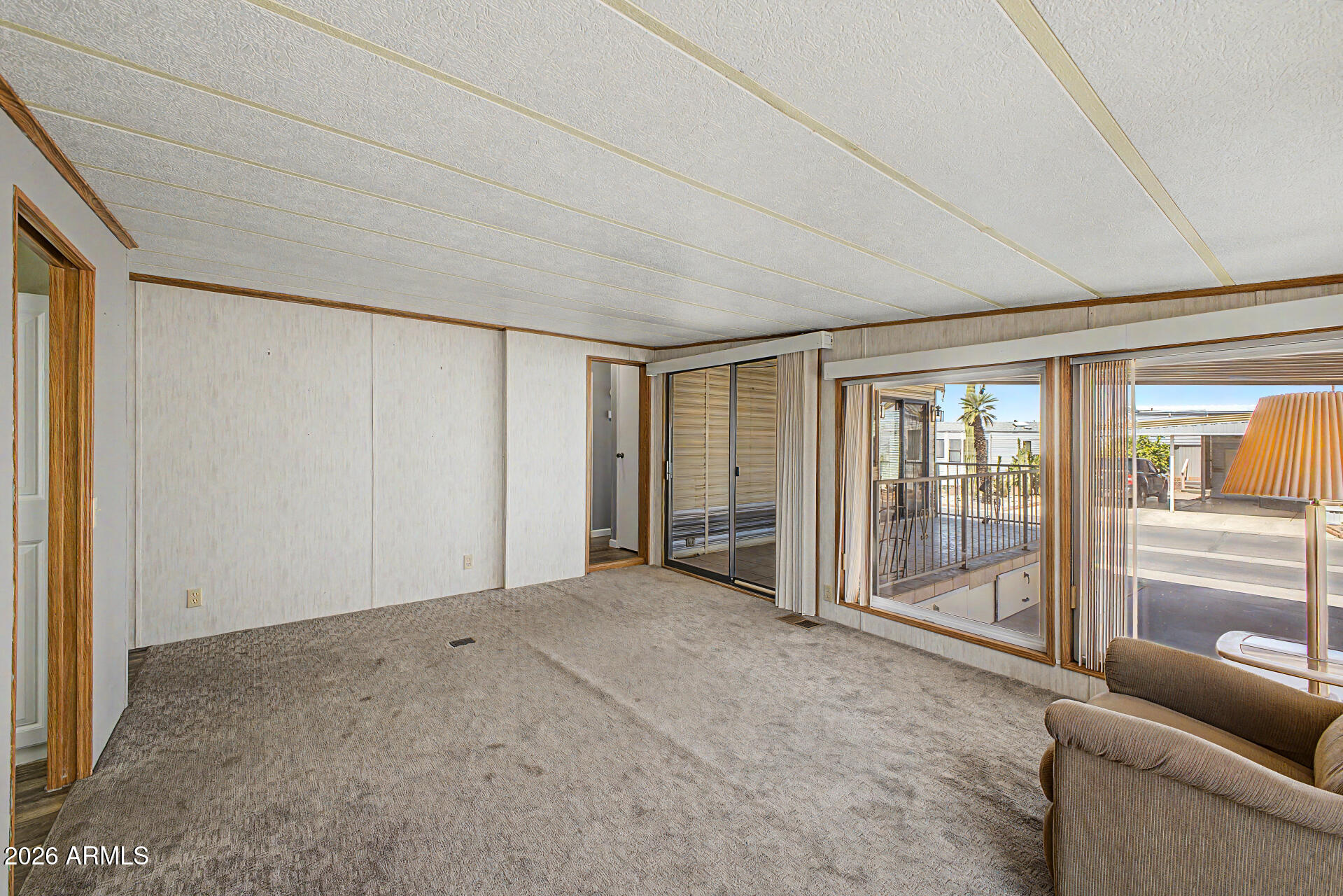 7750 East Broadway Road, Unit 560 Mesa, AZ 85208 - Photo 13 of 18 a view of livingroom with furniture and window