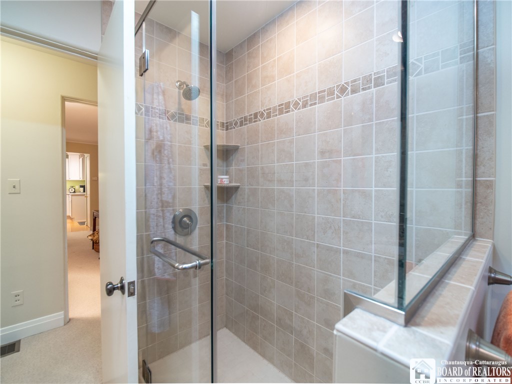 3605 Overlook Terrace Ellery, NY 14712 - Photo 27 of 40 Easy walk-in shower in the primary bathroom.