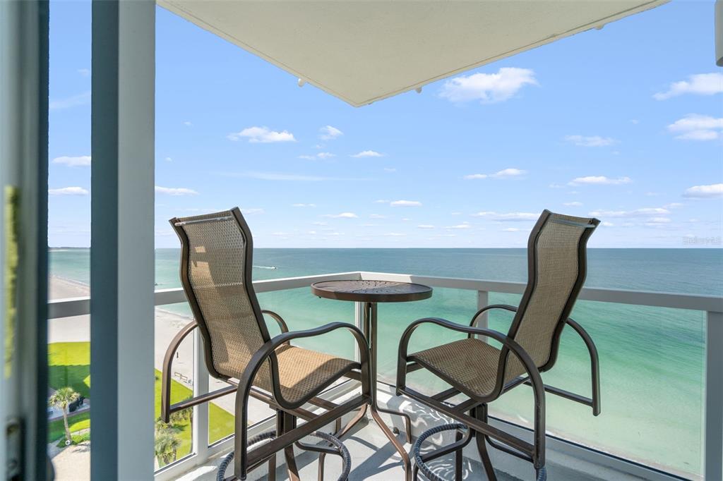 1050 Longboat Club Road, Unit 901 Longboat Key, FL 34228 - Photo 7 of 37 a view of a dining room with furniture and wooden floor