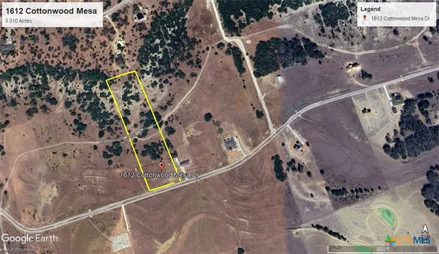 an aerial view of a house with outdoor space