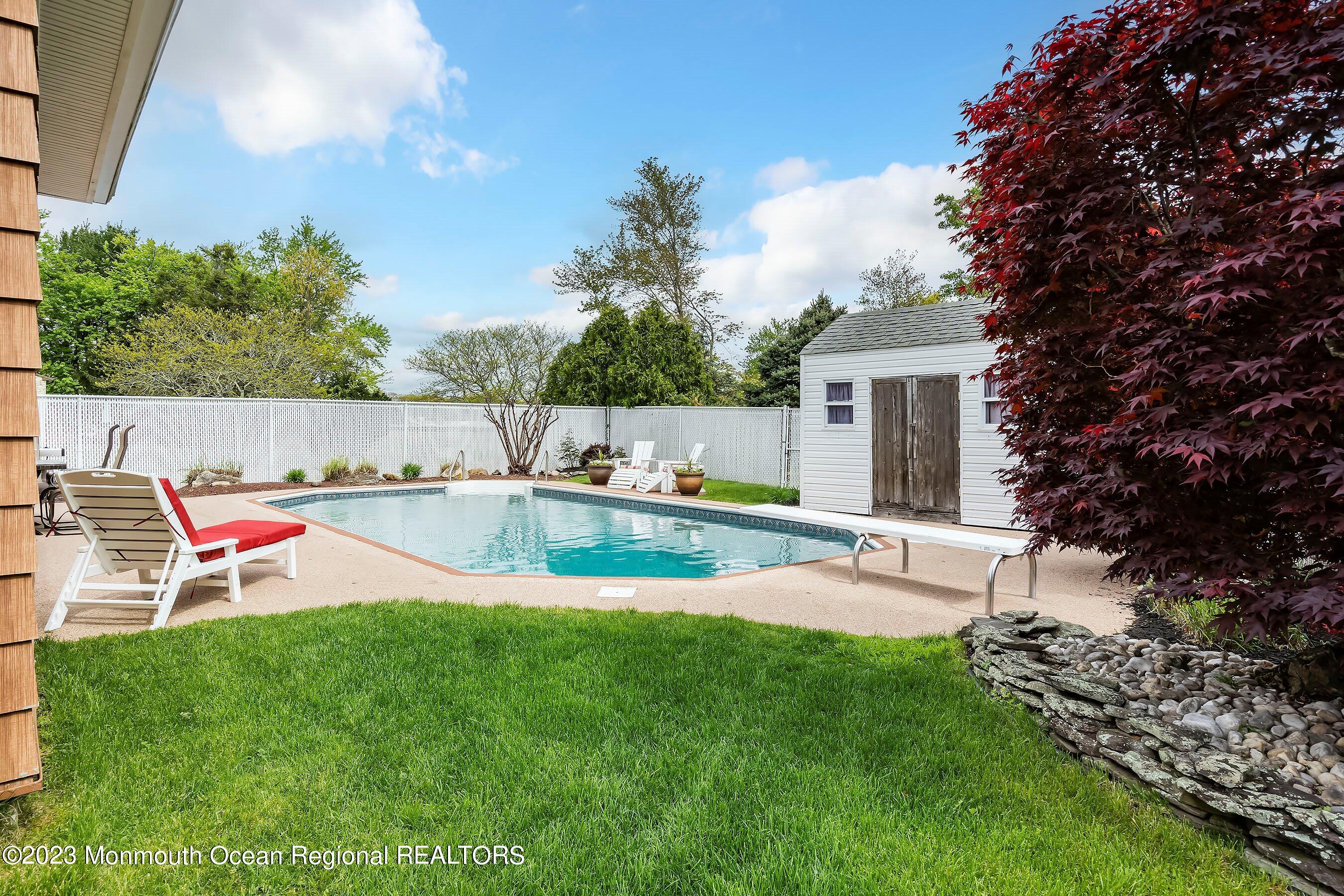 1 Hearth Court Howell, NJ 07731 - Photo 20 of 23 a view of a house with a yard and sitting area