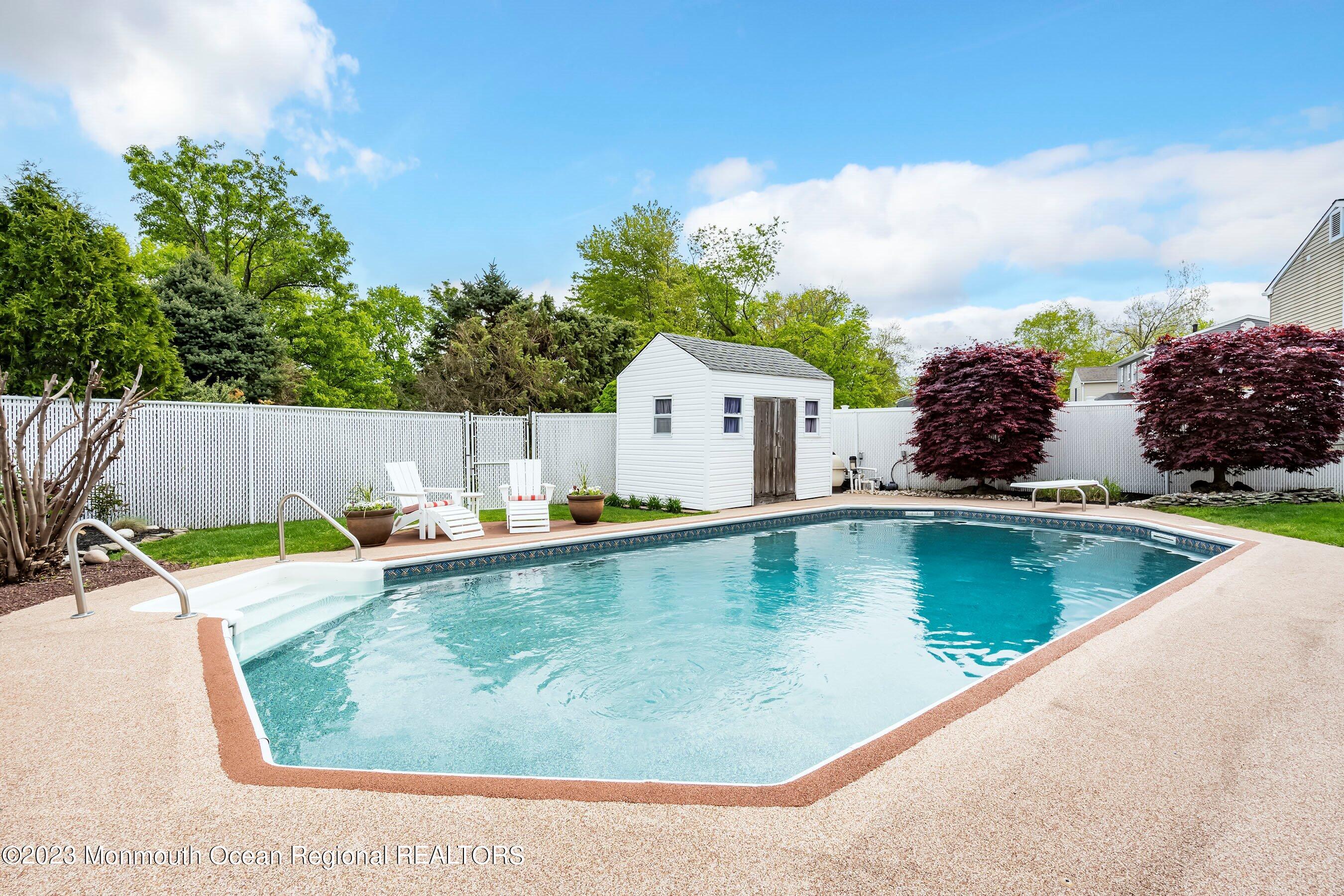 1 Hearth Court Howell, NJ 07731 - Photo 21 of 23 a view of a swimming pool with a lounge chairs