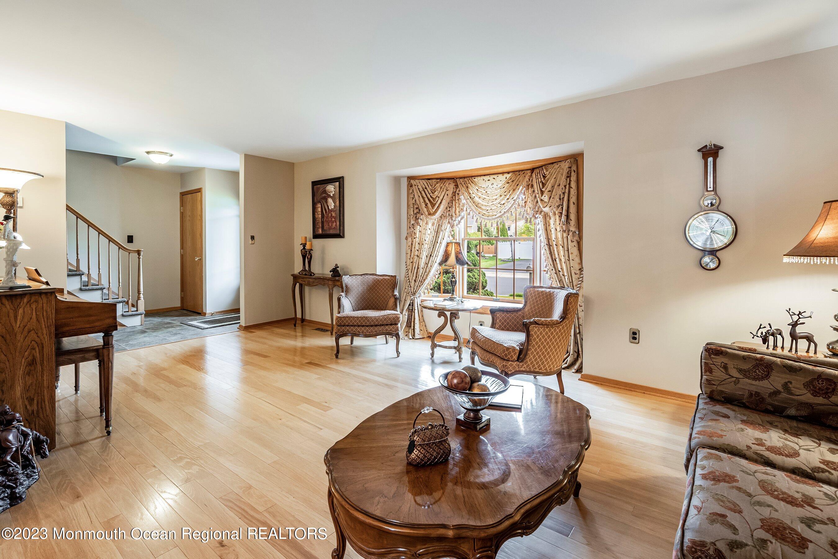 1 Hearth Court Howell, NJ 07731 - Photo 5 of 23 a living room with furniture and wooden floor