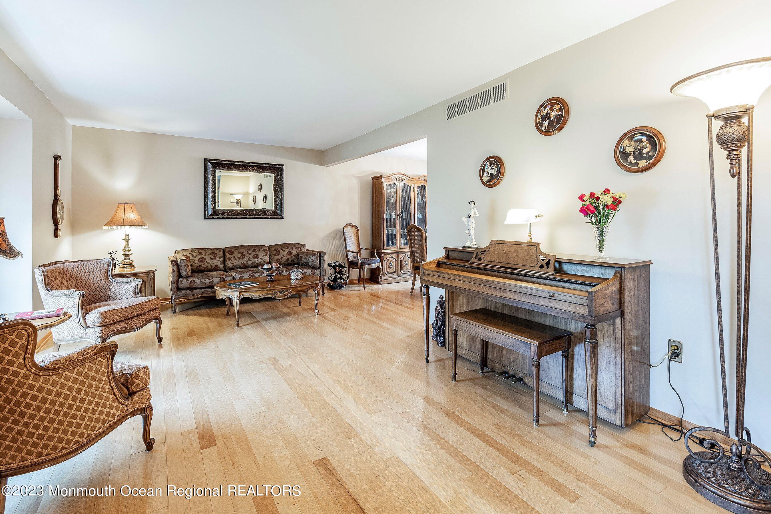 1 Hearth Court Howell, NJ 07731 - Photo 6 of 23 a living room with furniture and a wooden floor