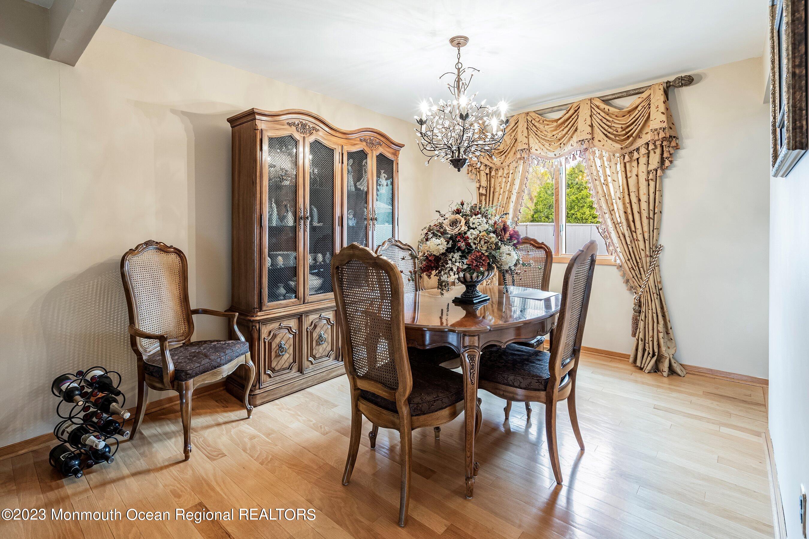 1 Hearth Court Howell, NJ 07731 - Photo 7 of 23 a view of a dining room with furniture and chandelier