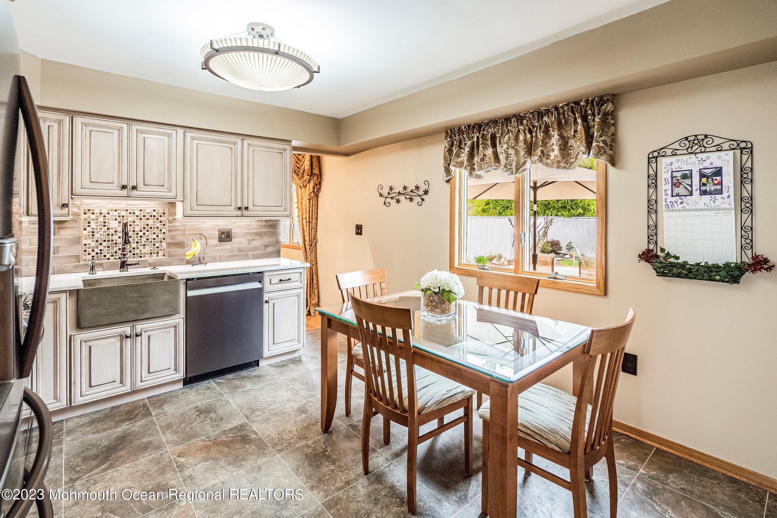 1 Hearth Court Howell, NJ 07731 - Photo 8 of 23 a view of a dining room with furniture window and outside view