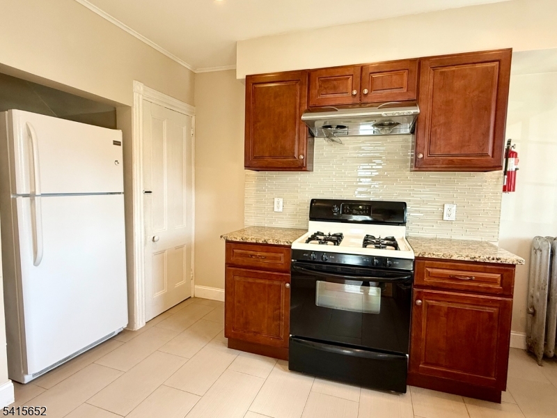 8 William Street Summit, NJ 07901 - Photo 11 of 17 a stove top oven sitting inside of a kitchen
