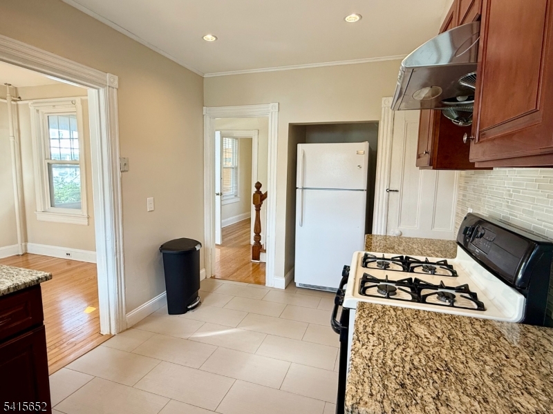 8 William Street Summit, NJ 07901 - Photo 12 of 17 a kitchen with a stove and a refrigerator