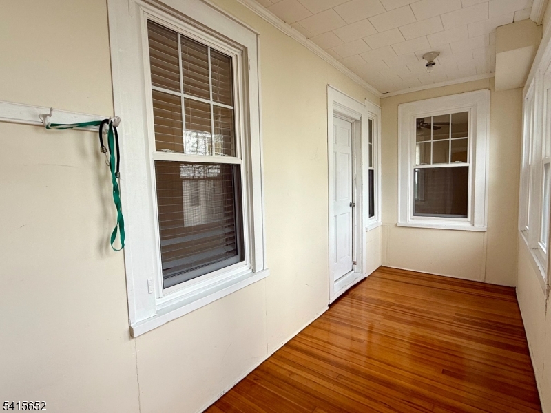 8 William Street Summit, NJ 07901 - Photo 5 of 17 a view of a hallway with wooden floor and a window