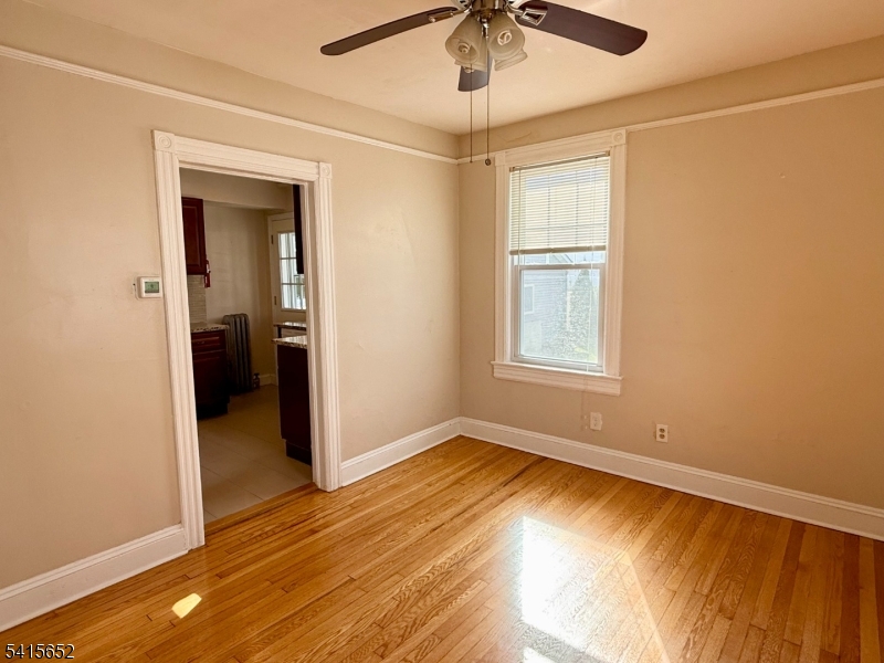 8 William Street Summit, NJ 07901 - Photo 9 of 17 a view of empty room with wooden floor and fan