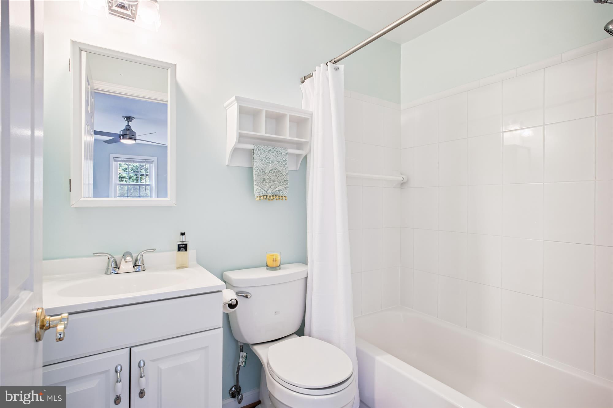 6709 Fairfax Road, Unit 72 Chevy Chase, MD 20815 - Photo 12 of 37 a bathroom with a sink toilet and shower