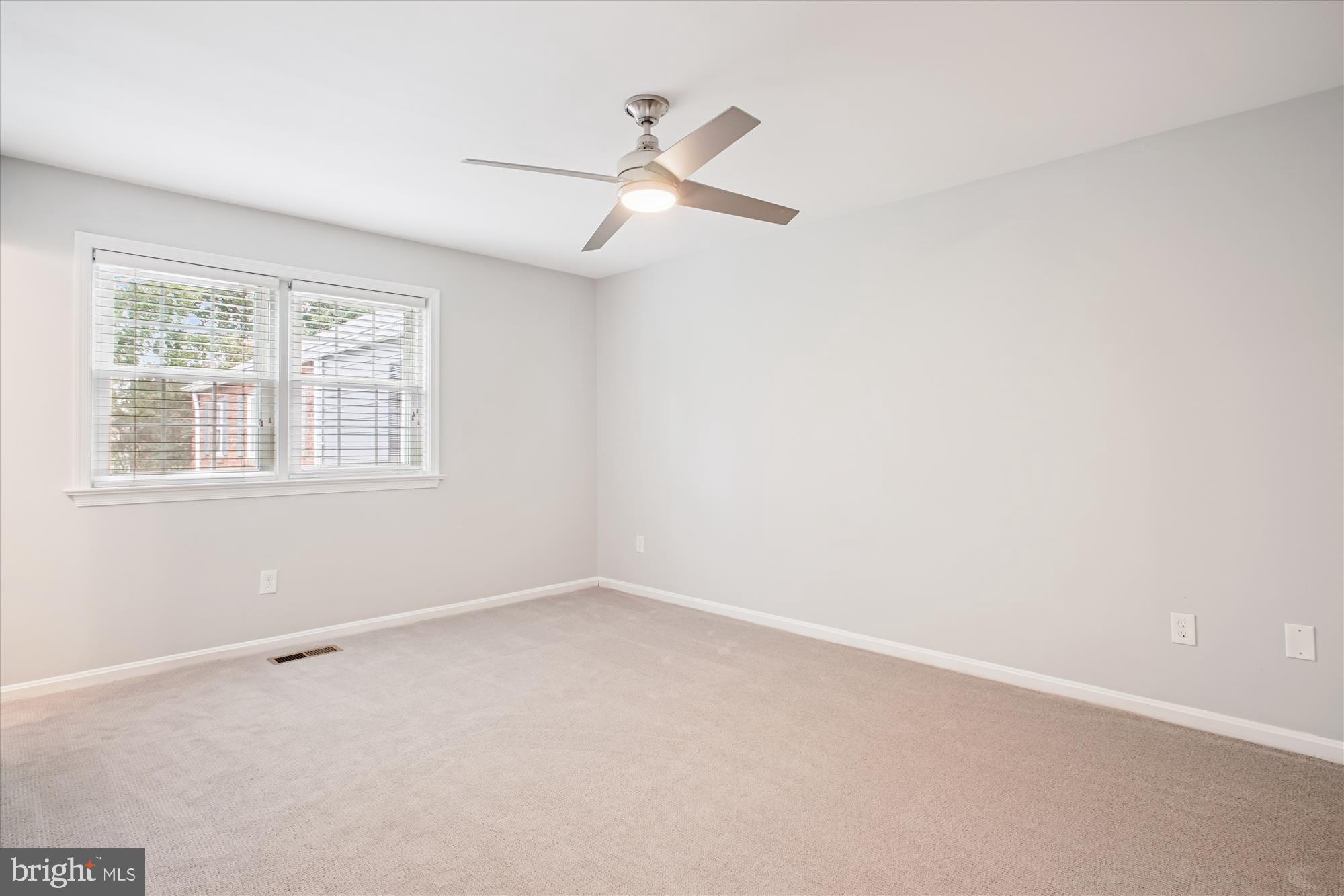6709 Fairfax Road, Unit 72 Chevy Chase, MD 20815 - Photo 13 of 37 an empty room with a window