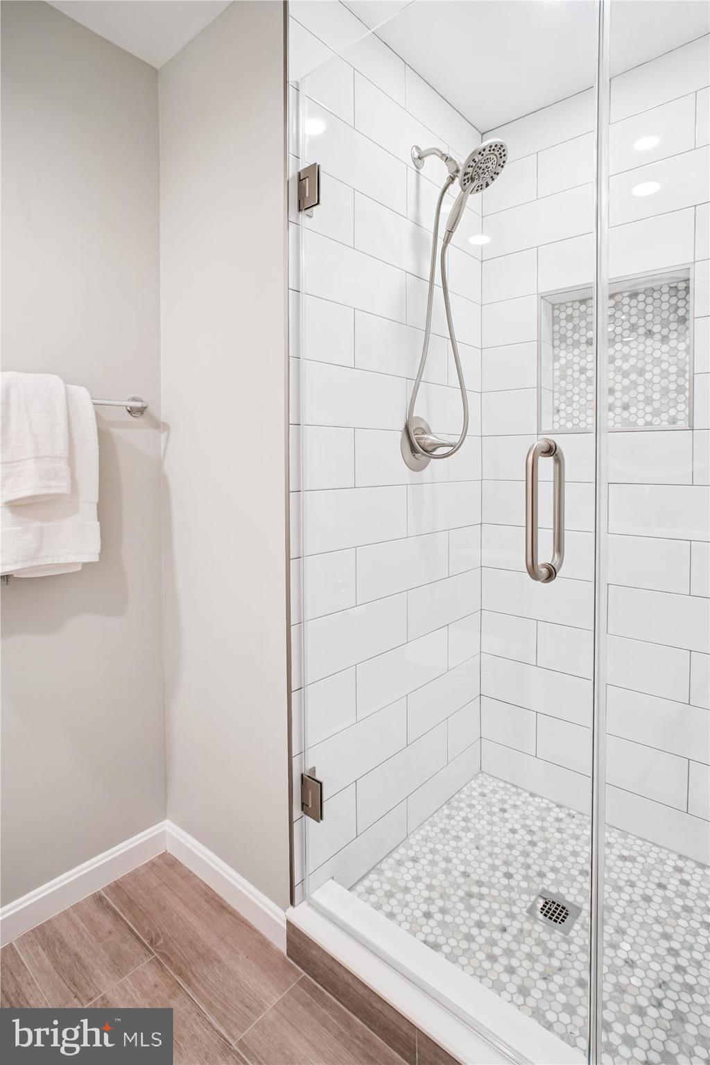 6709 Fairfax Road, Unit 72 Chevy Chase, MD 20815 - Photo 17 of 37 a bathroom with a shower