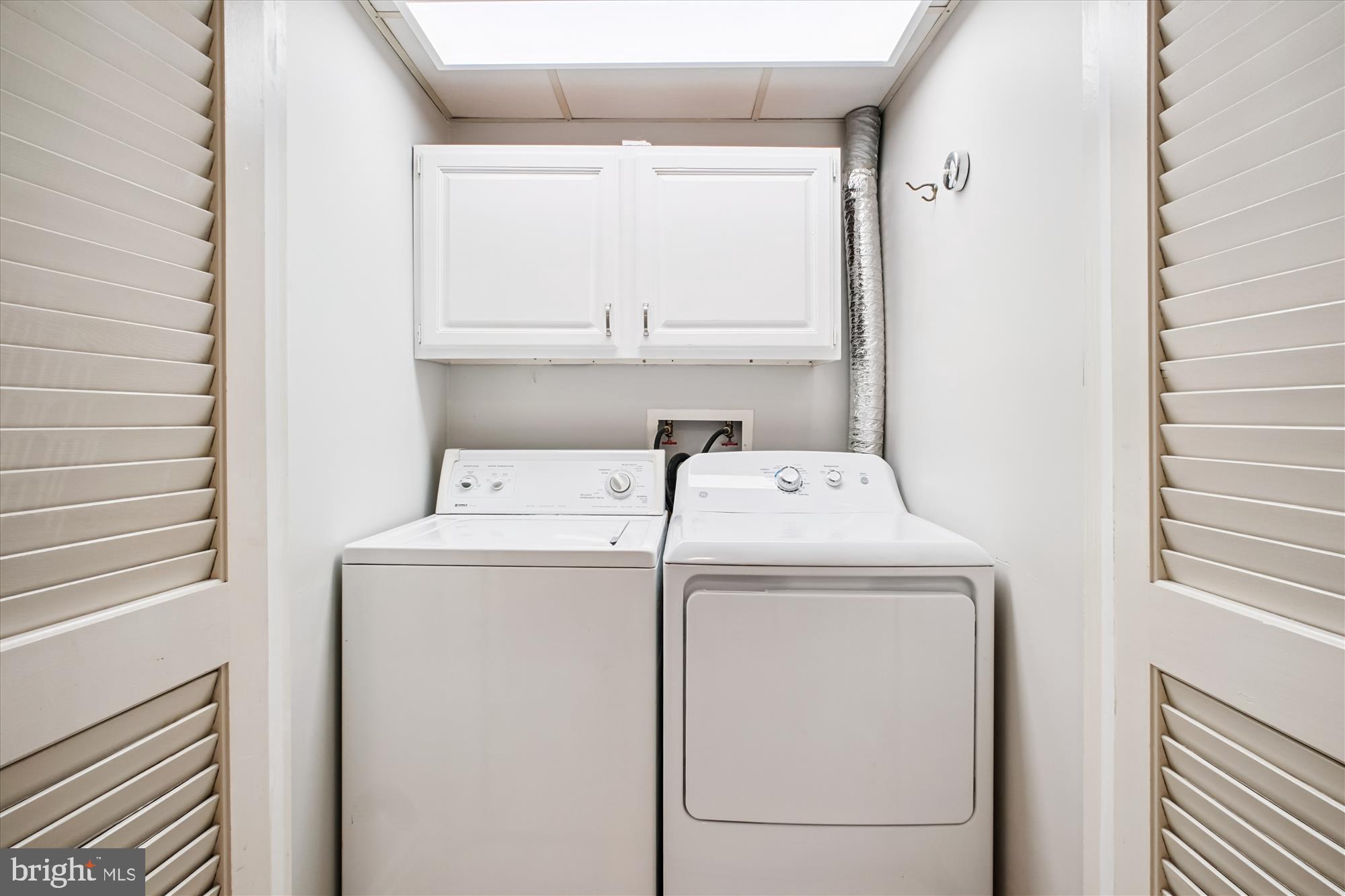 6709 Fairfax Road, Unit 72 Chevy Chase, MD 20815 - Photo 20 of 37 a utility room with dryer and washer