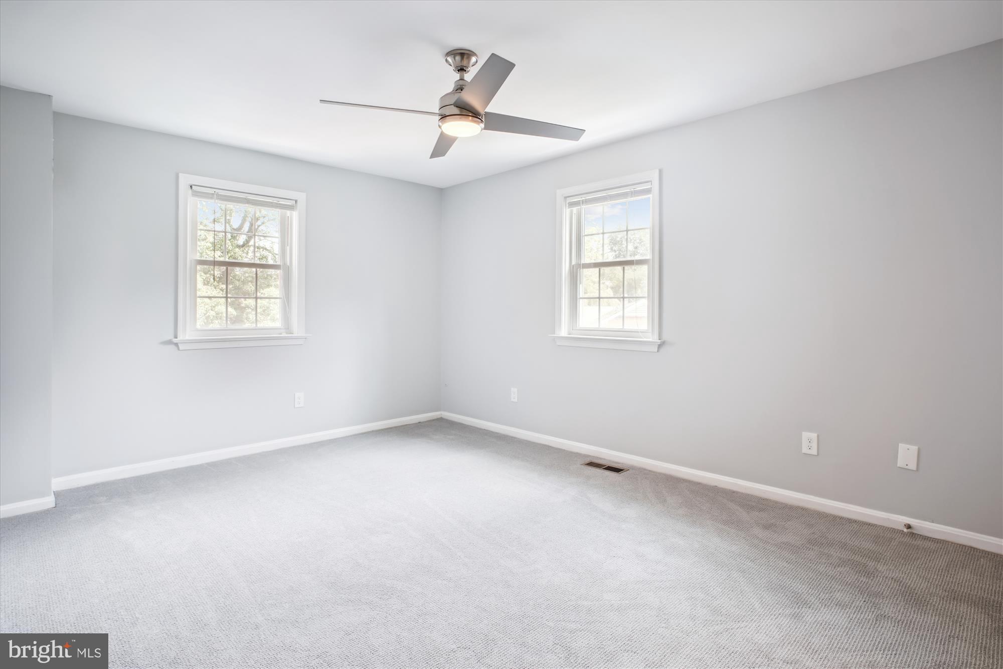 6709 Fairfax Road, Unit 72 Chevy Chase, MD 20815 - Photo 10 of 37 an empty room with a window and a ceiling fan