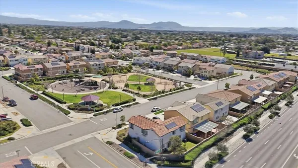 an aerial view of residential houses with outdoor space