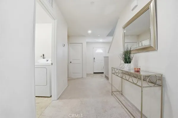 a view of an entryway with wooden floor