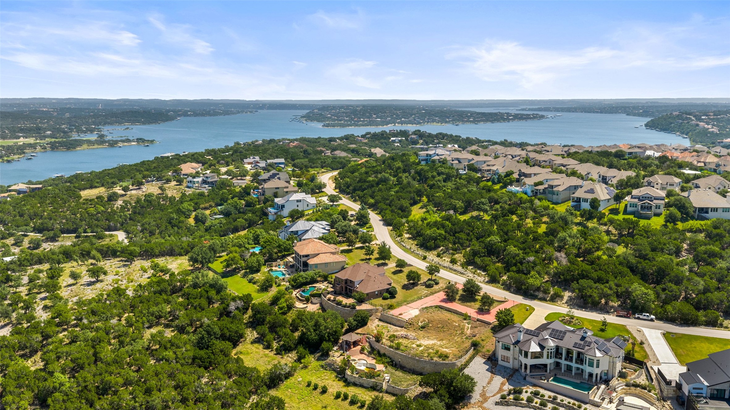 Situated above an arm of Bee Creek on Lake Travis. Lush, green, peaceful and private. The lot behind this home also conveys.