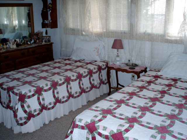 6958 South Pleasant Hill Road Hanover, IL 61041 - Photo 9 of 12 a bedroom with a bed and dresser