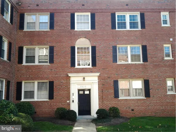 a front view of a house having yard and green space